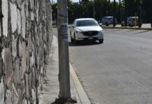 Sancionarán colocación de publicidad en postes de Puebla postes