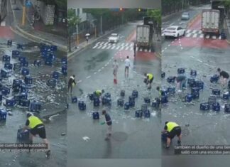 Vecinos ayudan a limpiar cerveza que cayó de un camión vecinos