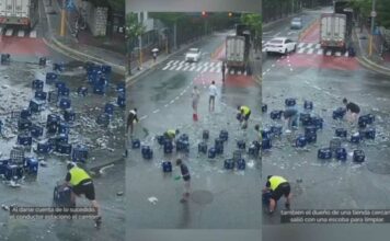 Vecinos ayudan a limpiar cerveza que cayó de un camión vecinos