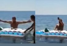 Cura celebra misa dentro del mar ante las altas temperaturas