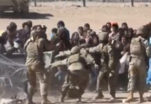 Migrantes enfrentan a Guardia Nacional de EU en frontera de Texas