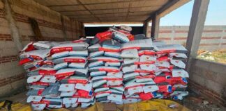 Hombres obligaron a conductor a descargar toneladas de maíz en Cuautlancingo maíz