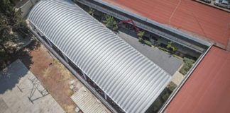 Omar Muñoz entrega techado en bachillerato de Almecatla