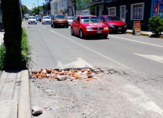 Conductores piden rehabilitación vial en avenida 18 Oriente