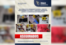 Catean dos inmuebles en Coronango; aseguran armas y droga